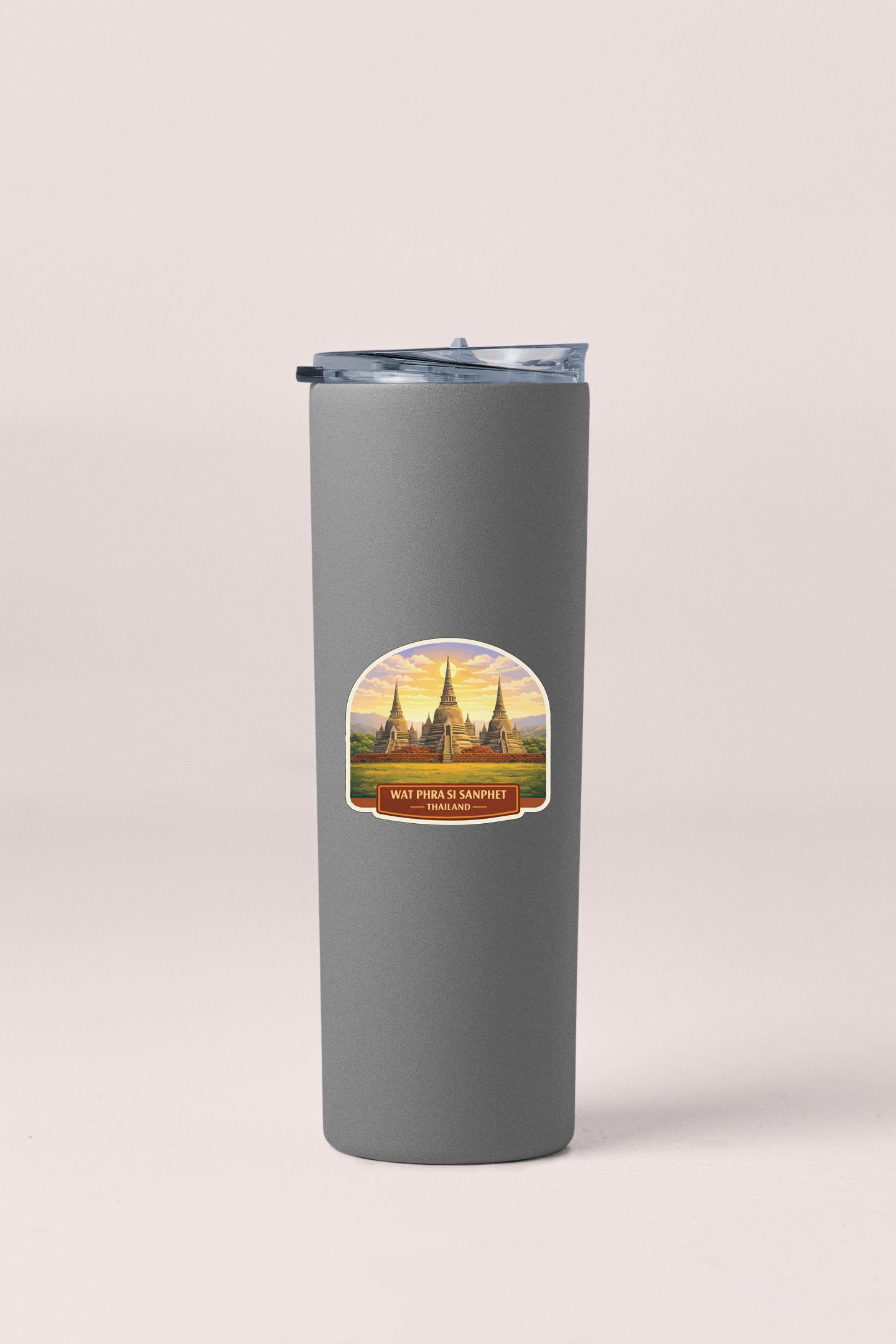 A gray insulated tumbler with a sticker depicting a temple in the background.