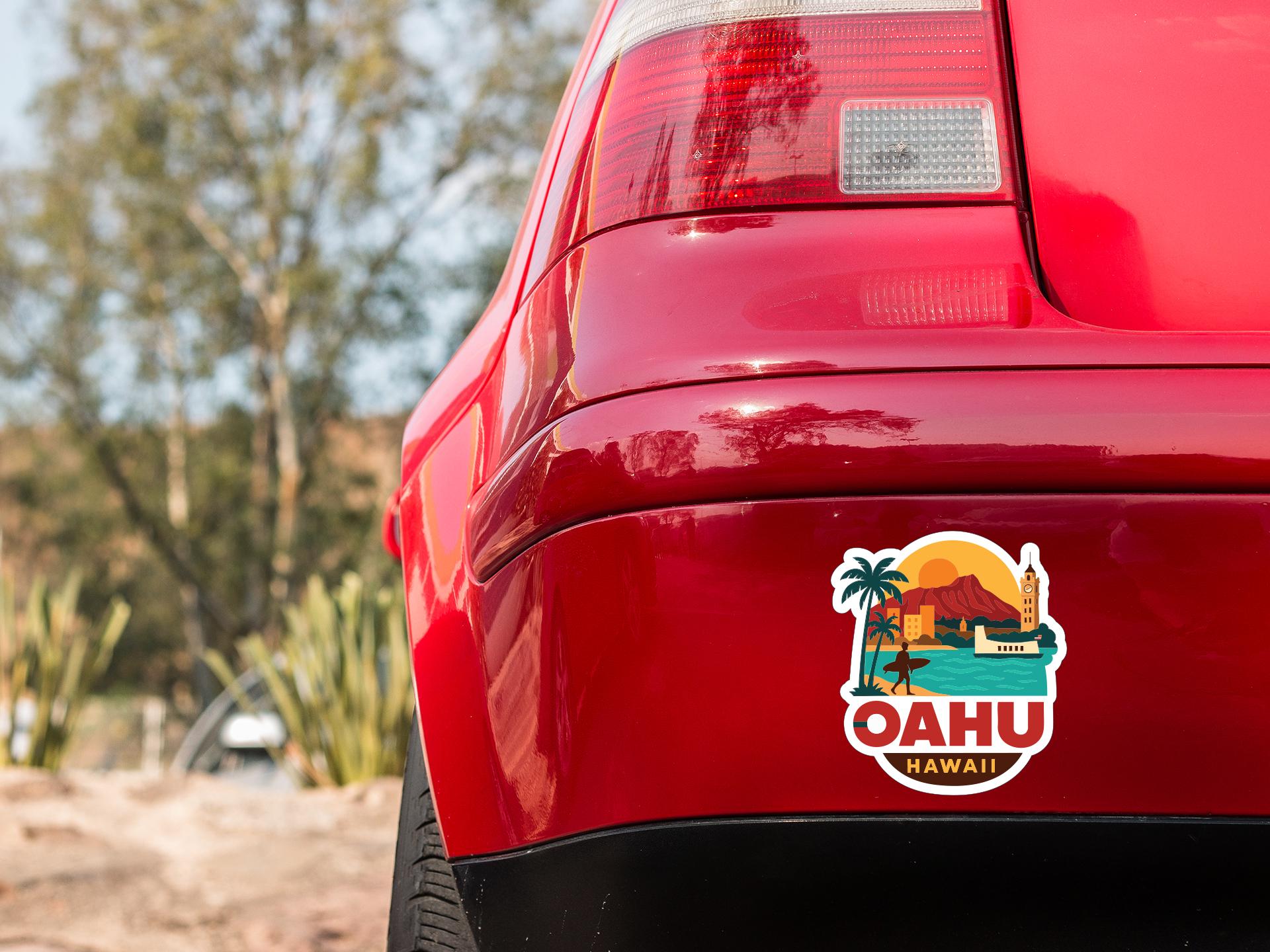 the rear end of a red car with a sticker on the back window that says "Oahu Hawaii".