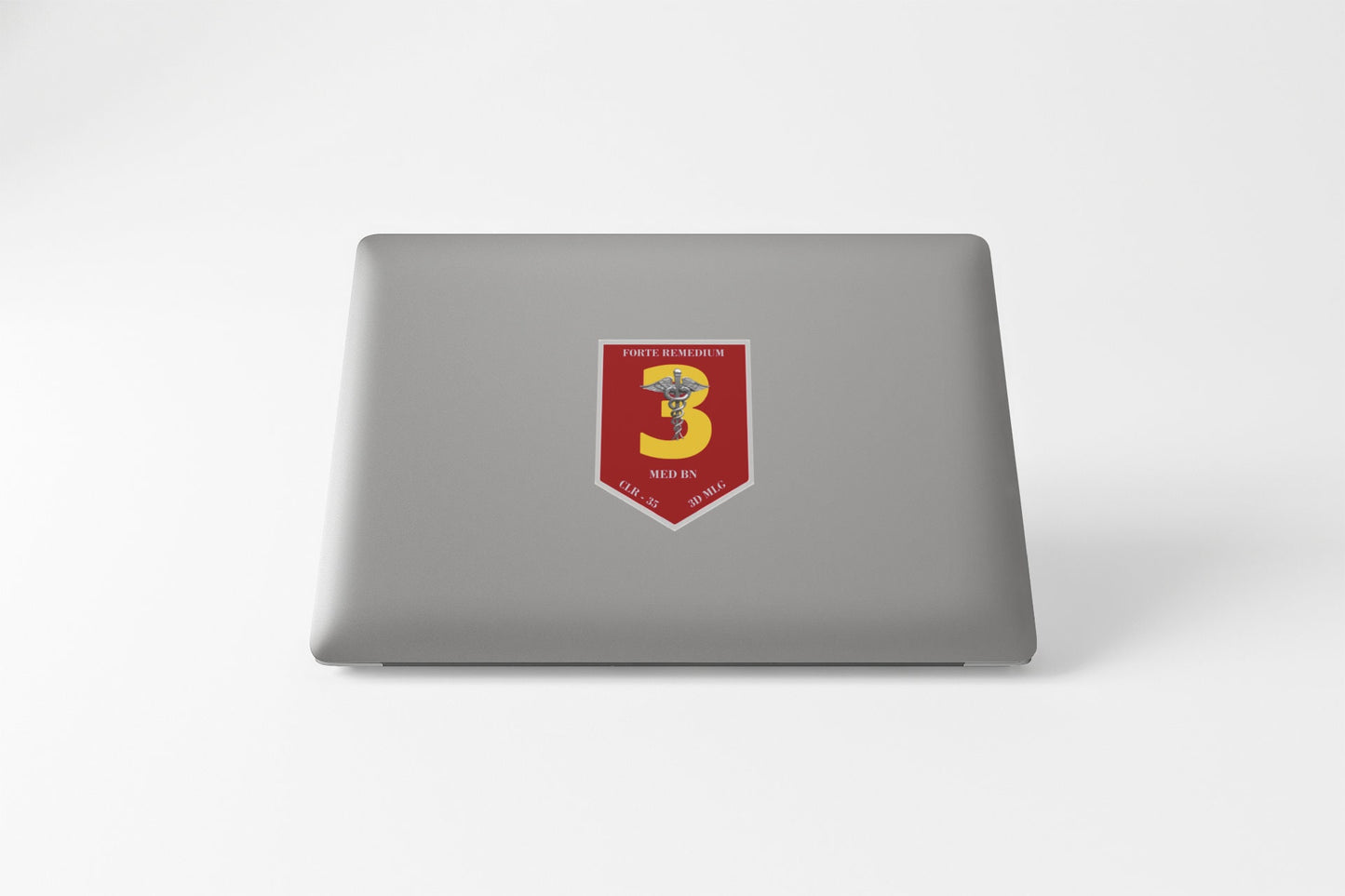 a laptop with a red and yellow emblem on it