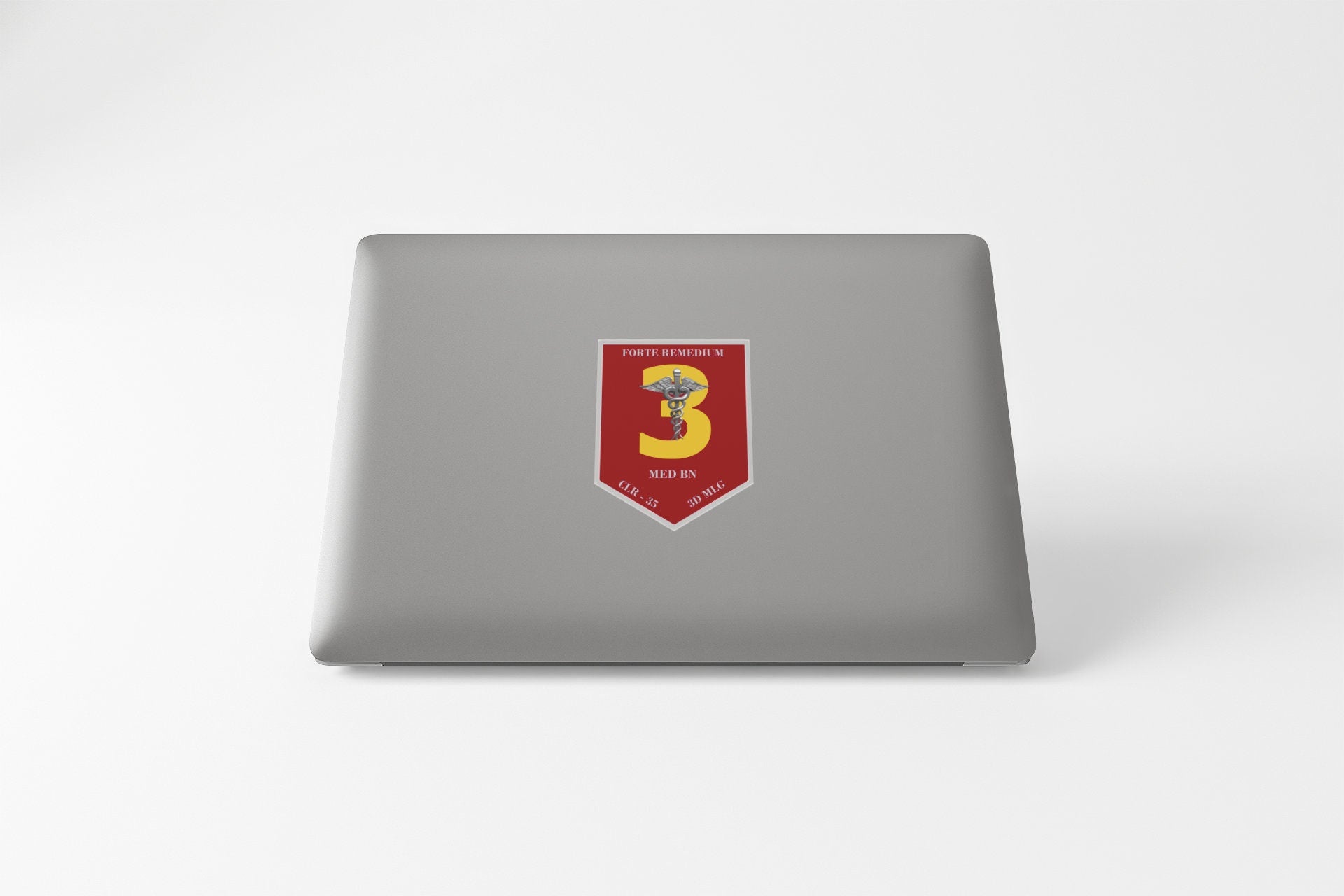 a laptop with a red and yellow emblem on it
