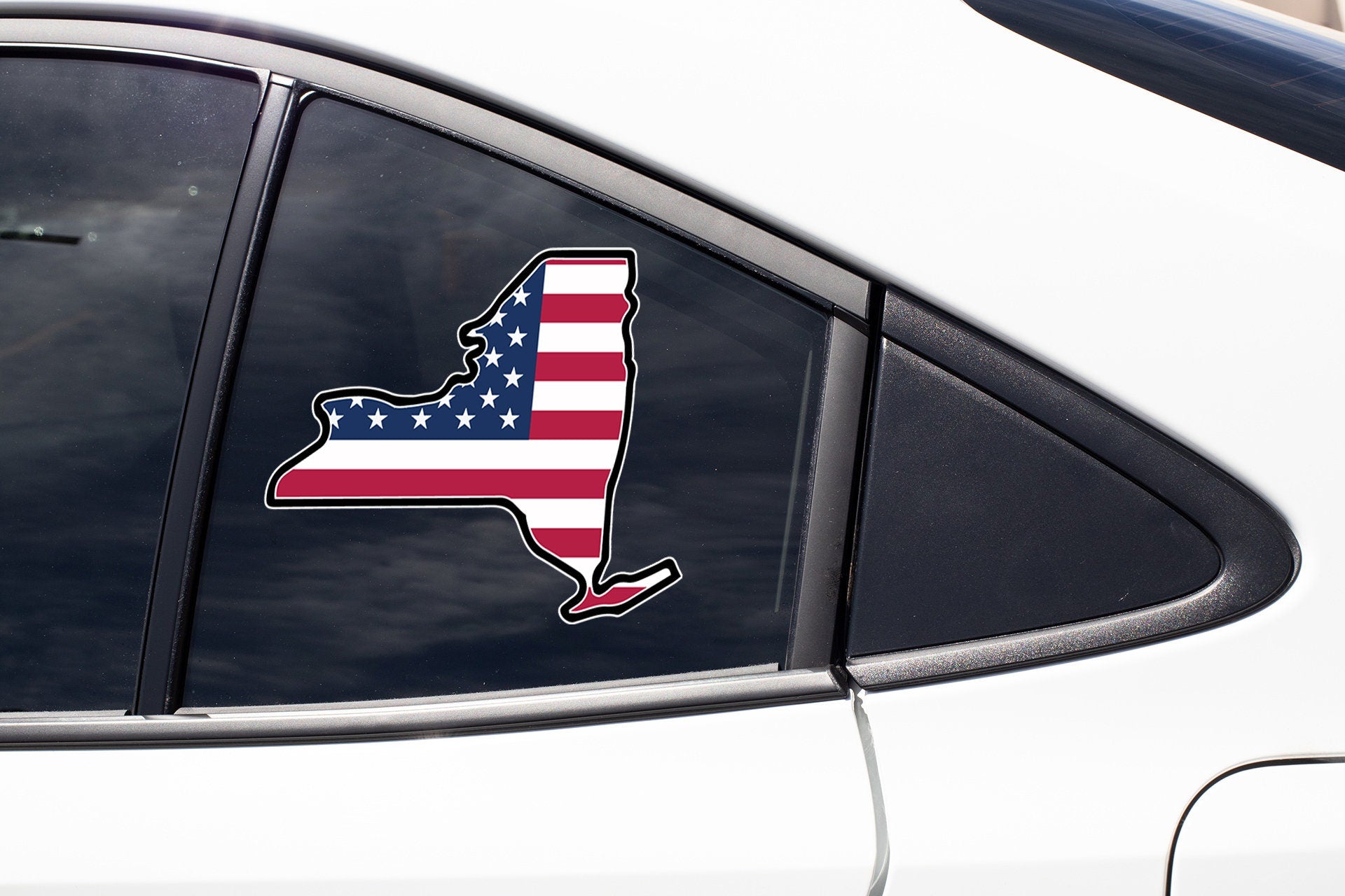 a car with a sticker of the state of rhode on it