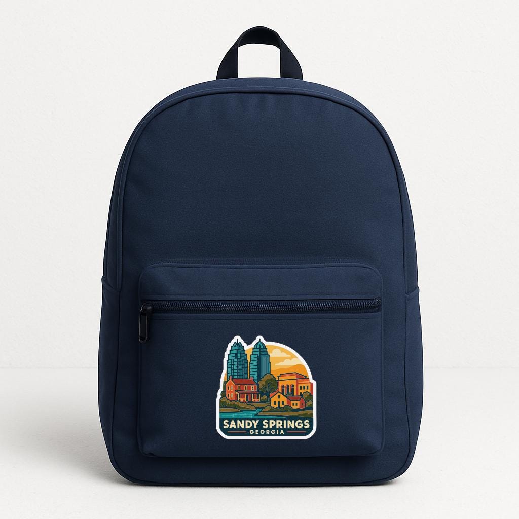 A navy blue backpack with a graphic of a cityscape and the text "SANDY SPRINGS, GEORGIA" printed on it.