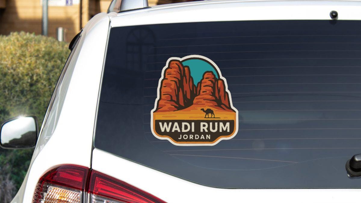a sticker on the rear window of a car that says "Wadi Rum Jordan".