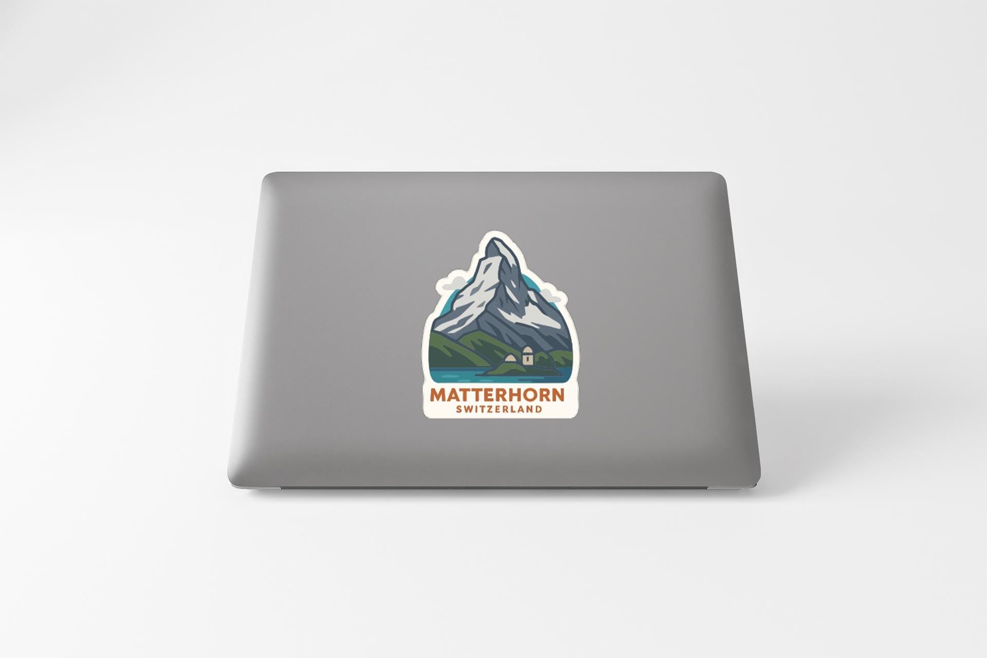A sticker depicting the Matterhorn mountain on a laptop.