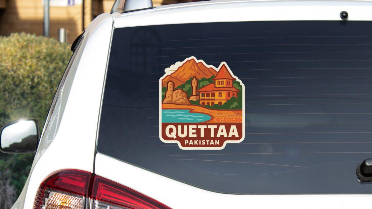 A sticker on the rear window of a car that says "Quettaa Pakistan".