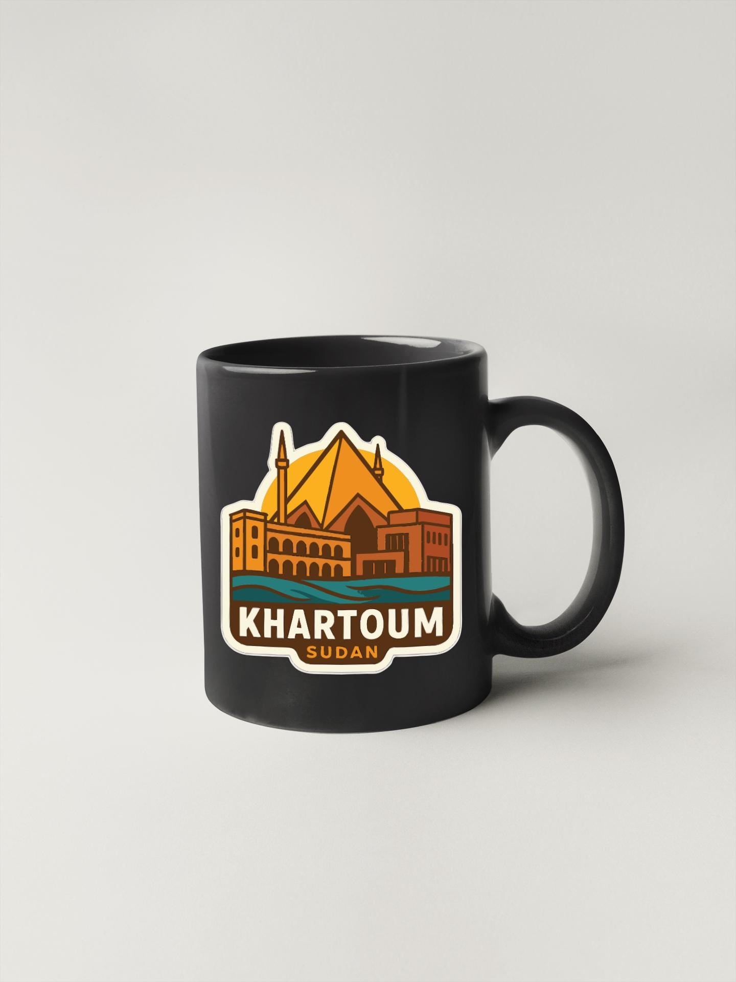 A black coffee mug with a graphic design depicting a city skyline and the text "Khartoum Sudan" printed on it.