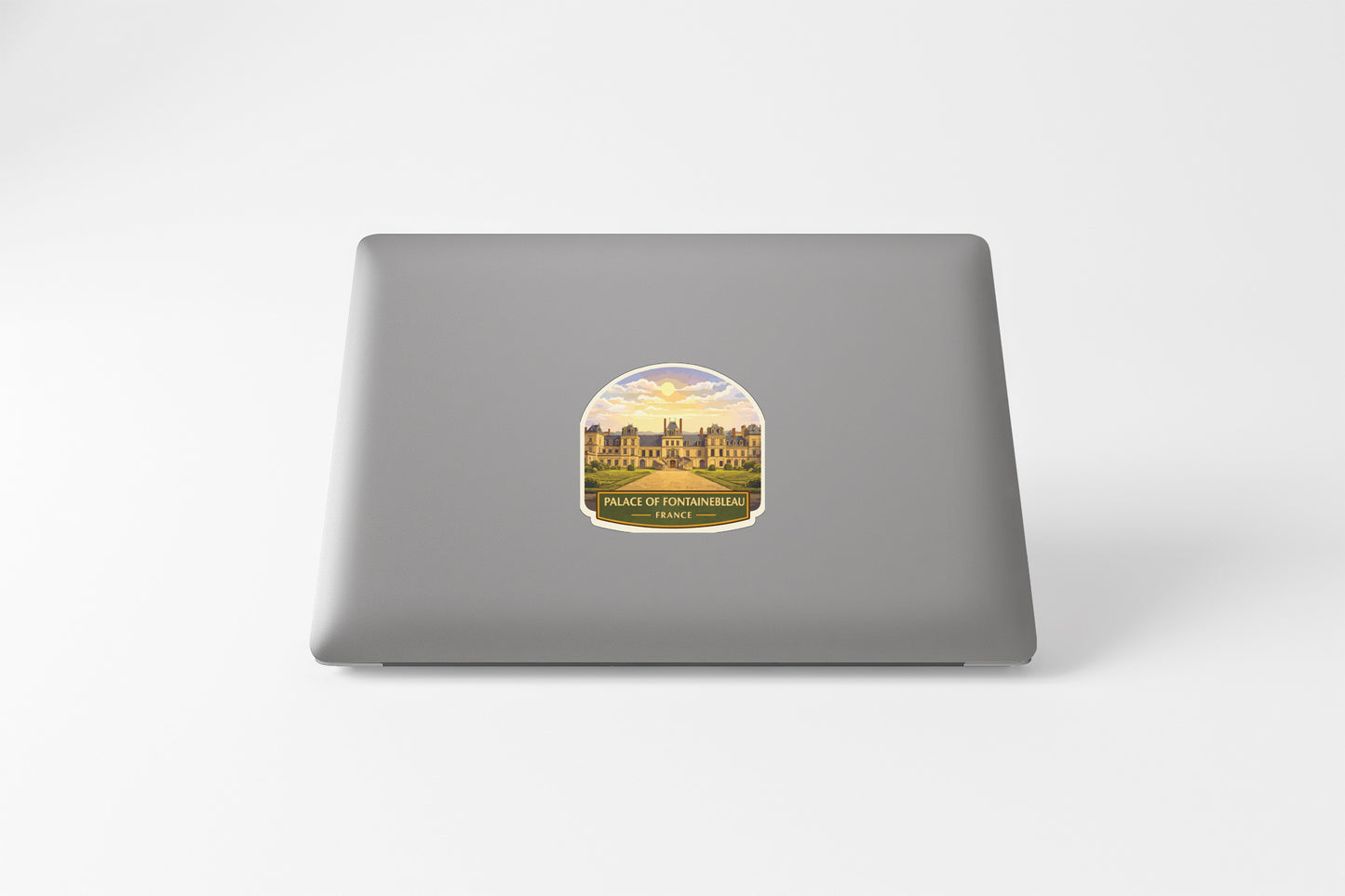 A sticker depicting a castle or palace with a sunrise or sunset in the background.