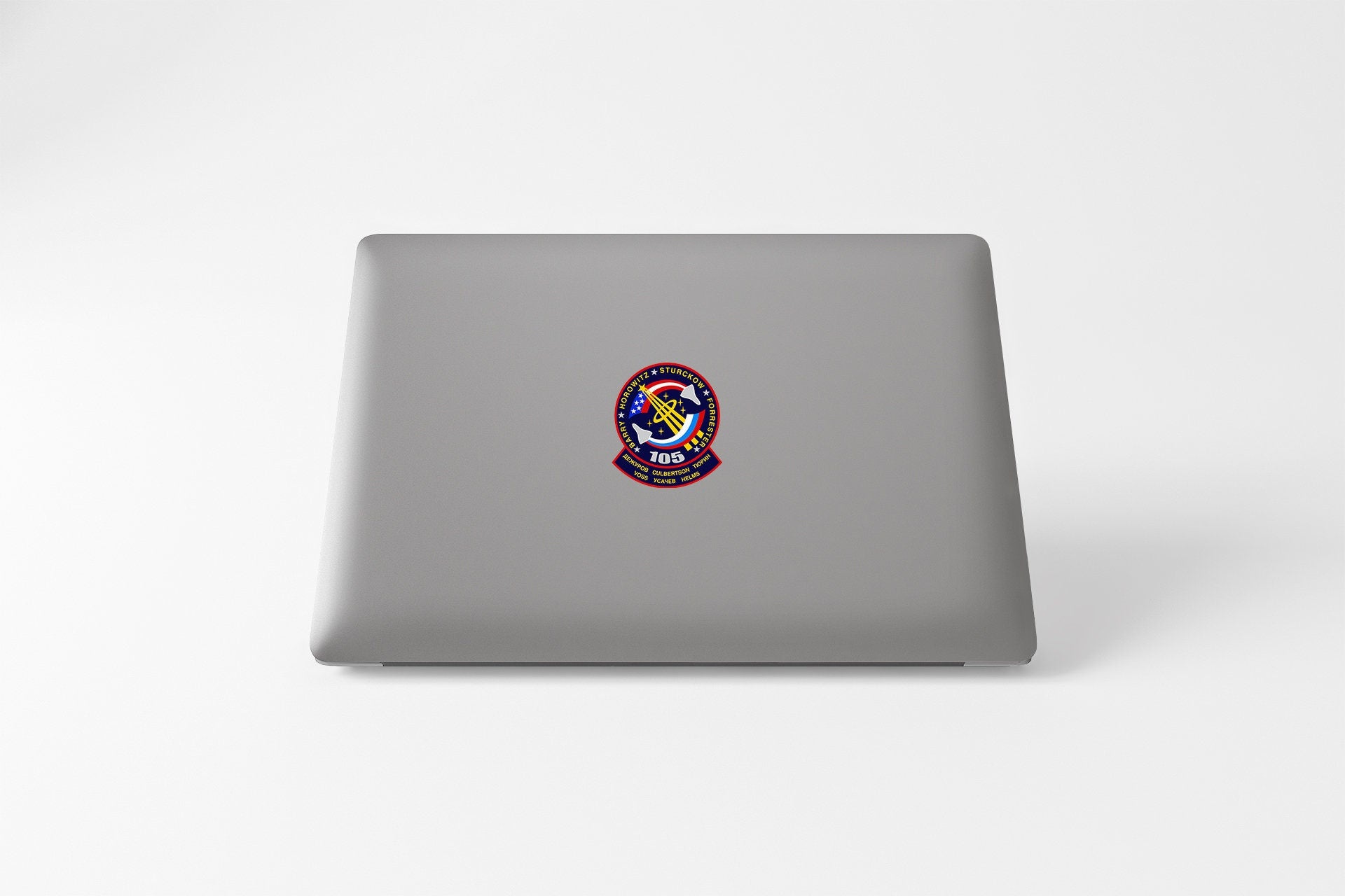 a laptop with a sticker of a person's face