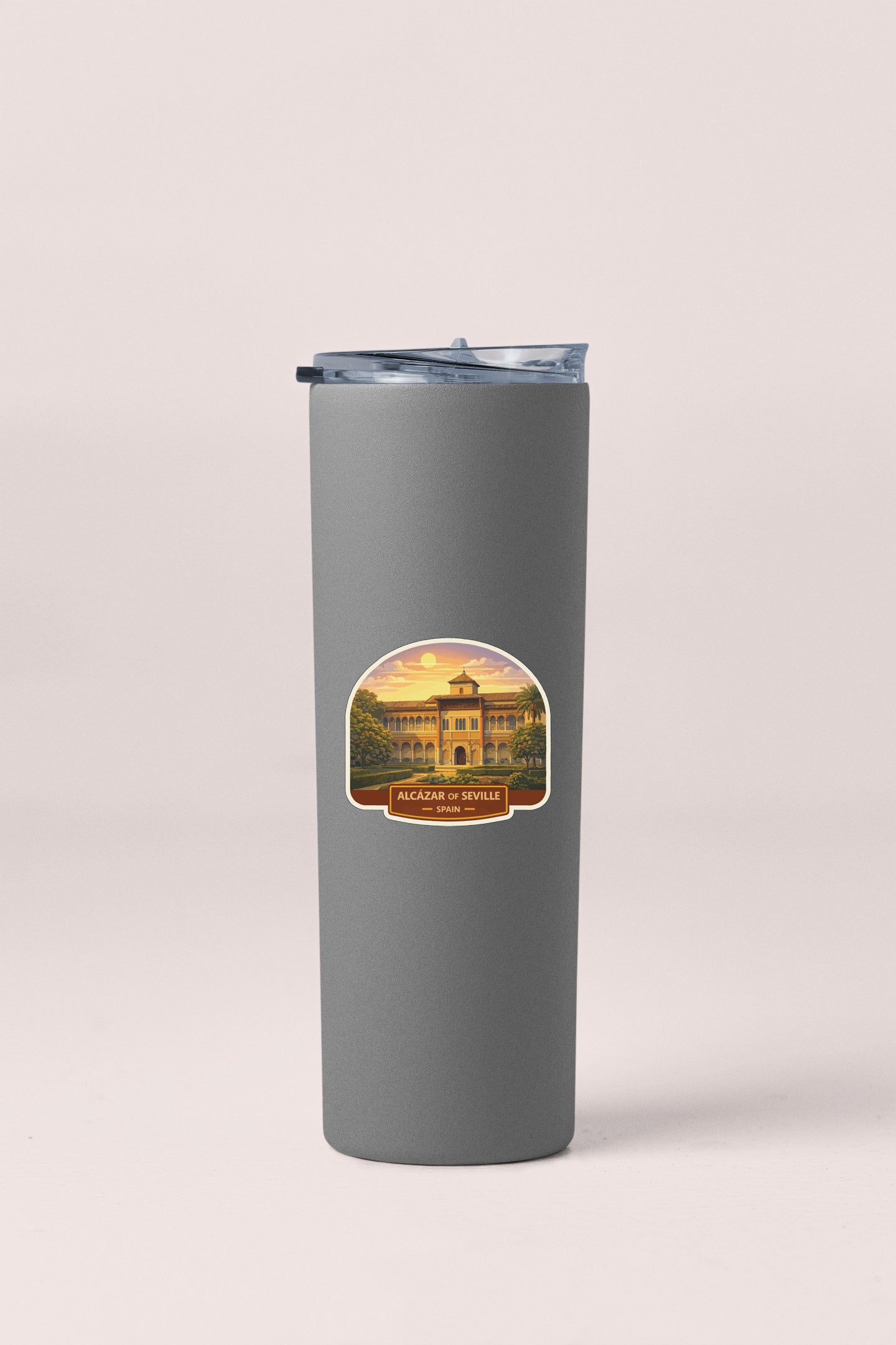 A gray insulated tumbler with a sticker depicting a building and the text "ALCASIO DE VENICE" printed on it.