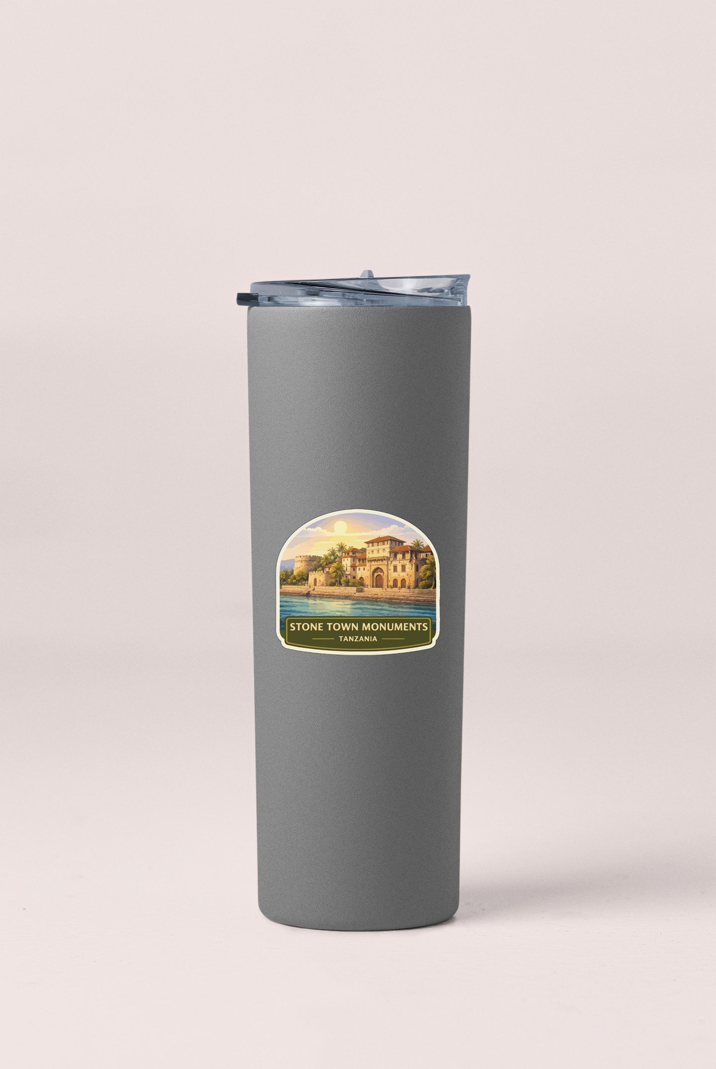 A gray tumbler with a label that says "STONE TOWN MONUMENTS ZANZAHA".