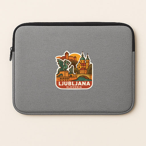 A gray laptop sleeve with a sticker depicting the city of Ljubljana, Slovenia.