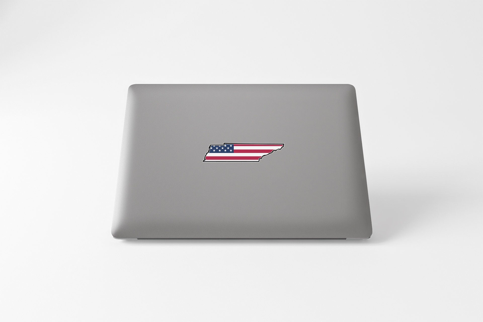 a laptop with a sticker of the state of indiana