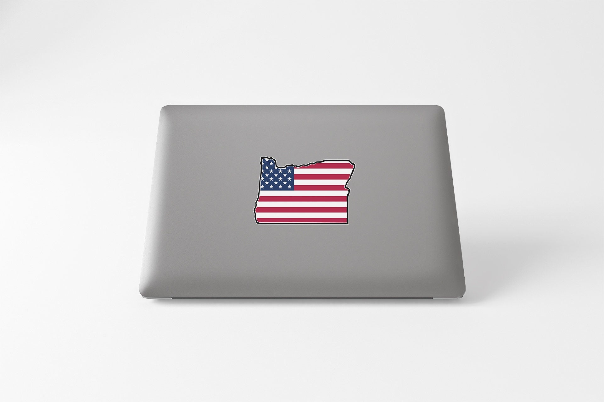 a laptop with a sticker of the state of wisconsin