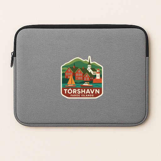 A gray laptop sleeve with a sticker depicting a scenic view of Torshavn, Faroe Islands.