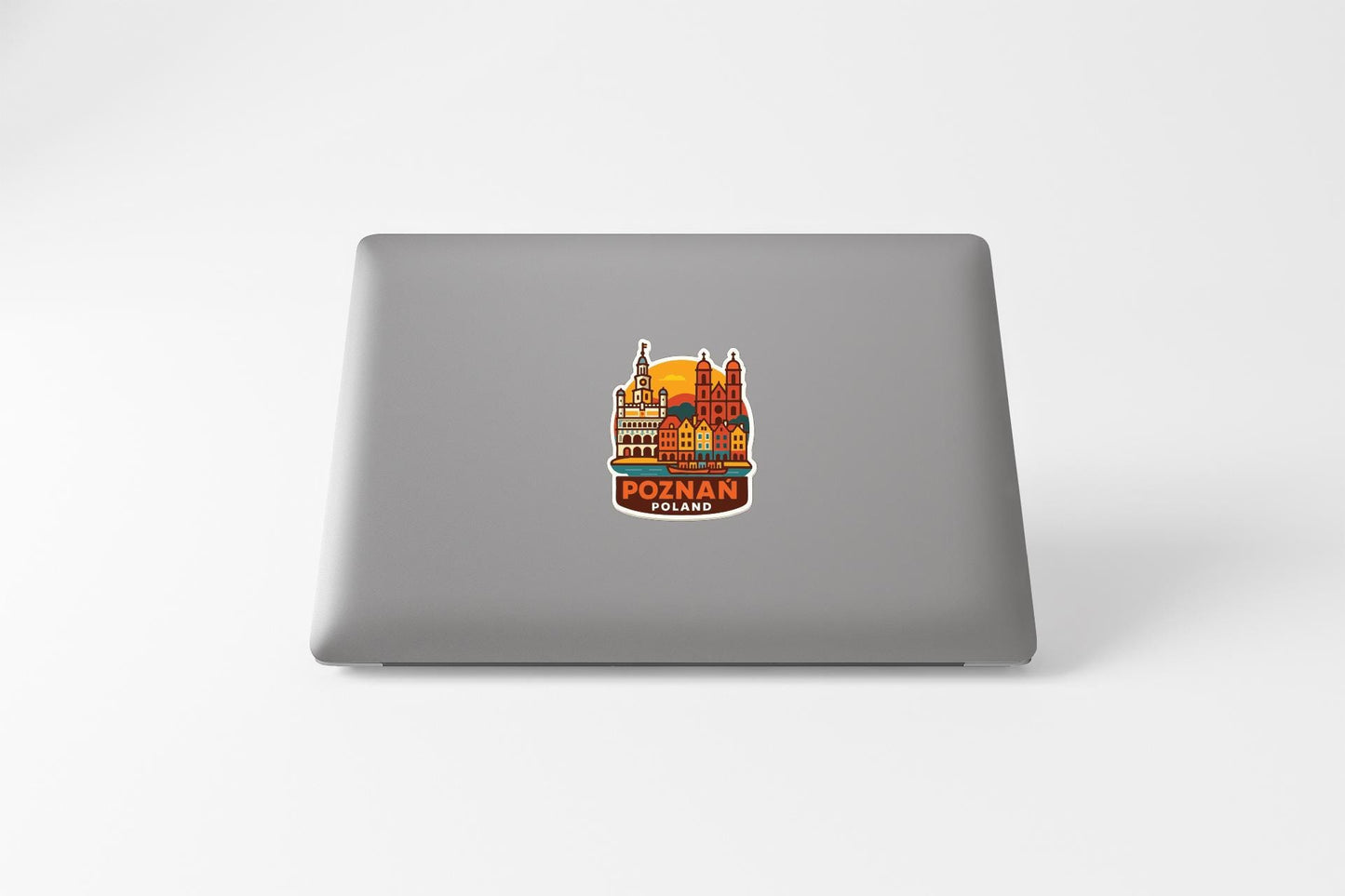 A sticker depicting a cityscape with a castle or palace in the center, surrounded by various buildings and structures.