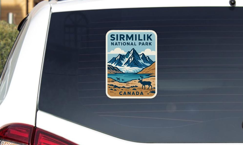 a sticker on the rear window of a vehicle, depicting a scenic landscape with mountains, a lake, and a moose.