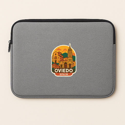a gray laptop sleeve with a sticker of the city of Oviado, Spain.
