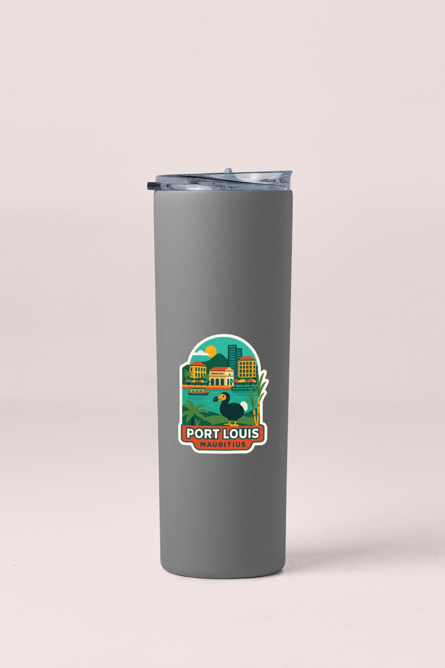 A gray insulated tumbler with a sticker depicting a cityscape and the text "PORT LOUIS MARITIME".