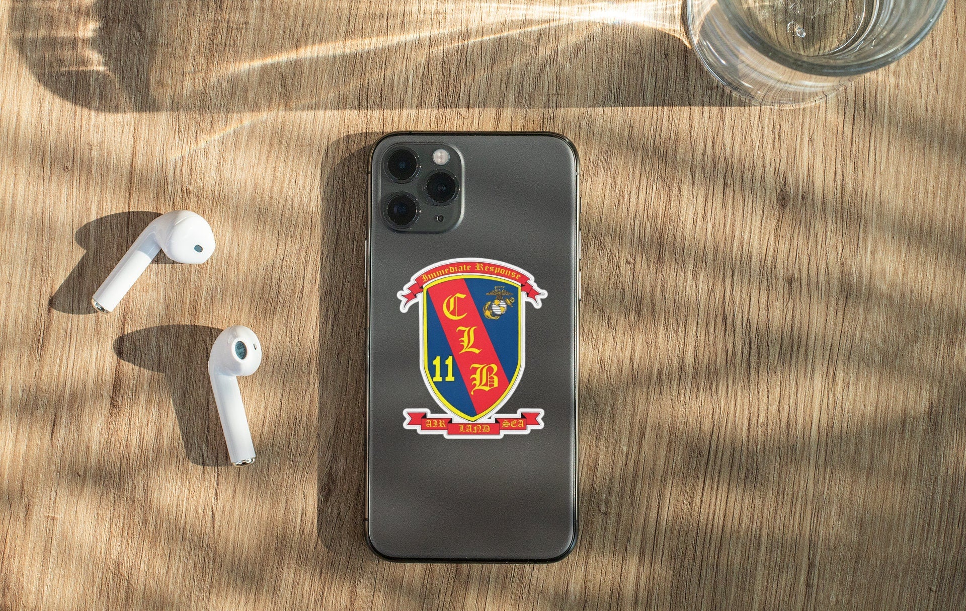 a cell phone sitting on top of a wooden table