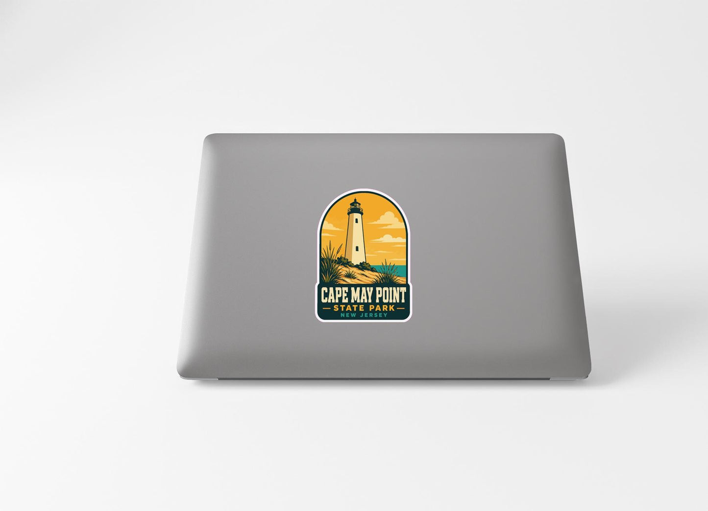 a sticker with a lighthouse and the text "Cape May Point State Park" on a laptop.