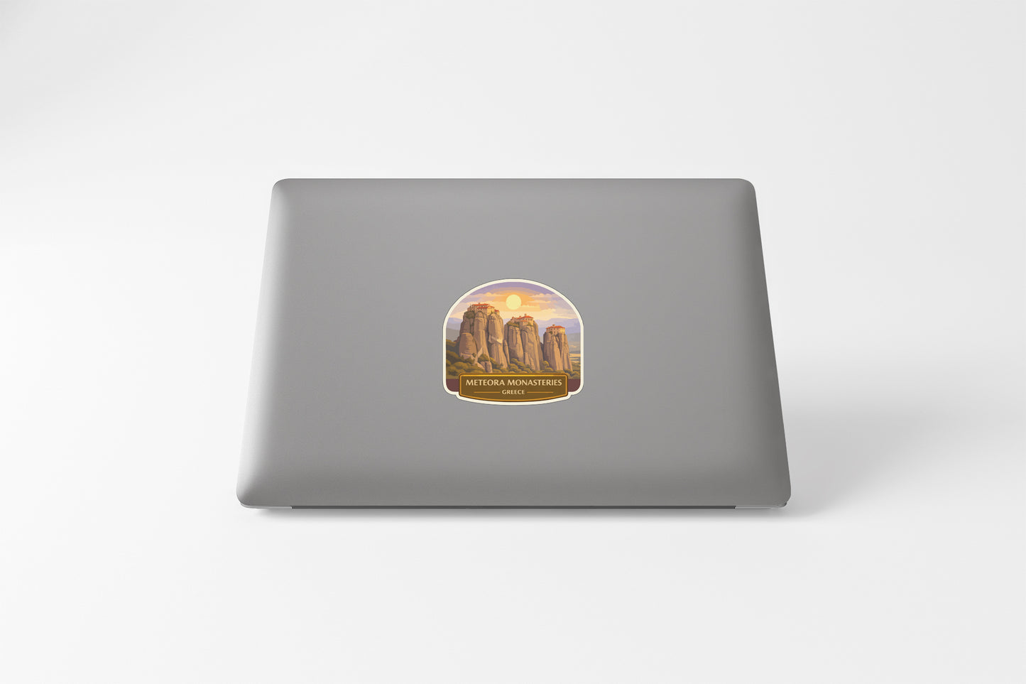 a sticker with a desert landscape on a laptop.