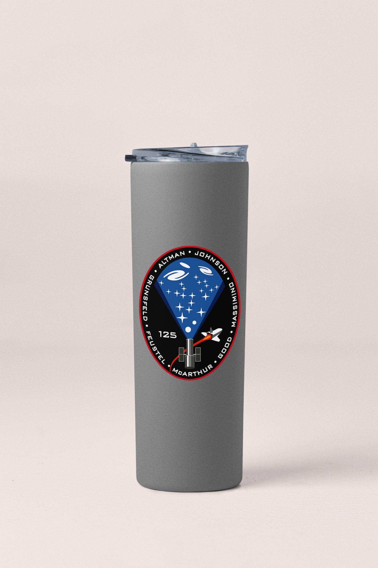 a stainless steel tumbler with a blue diamond on it