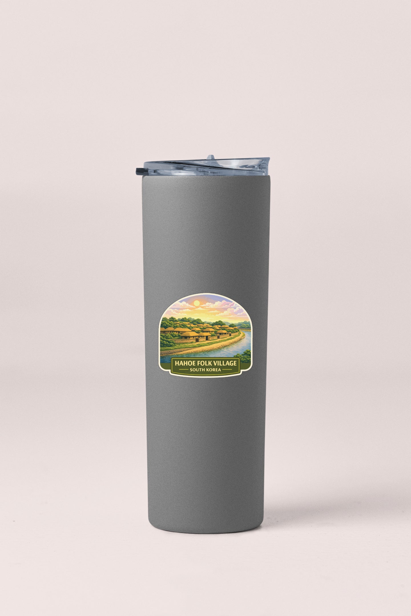 A gray insulated tumbler with a label that reads "HAHDE FOLK VILLAGE SOUTH KOREA".