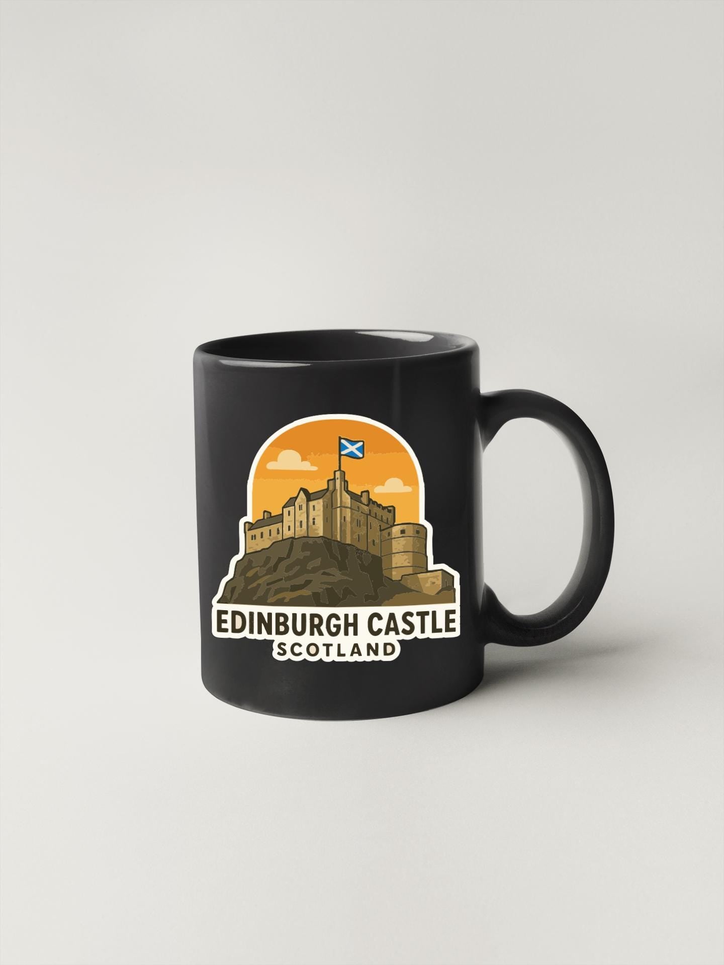 A black coffee mug with a graphic design depicting the Edinburgh Castle in Scotland.