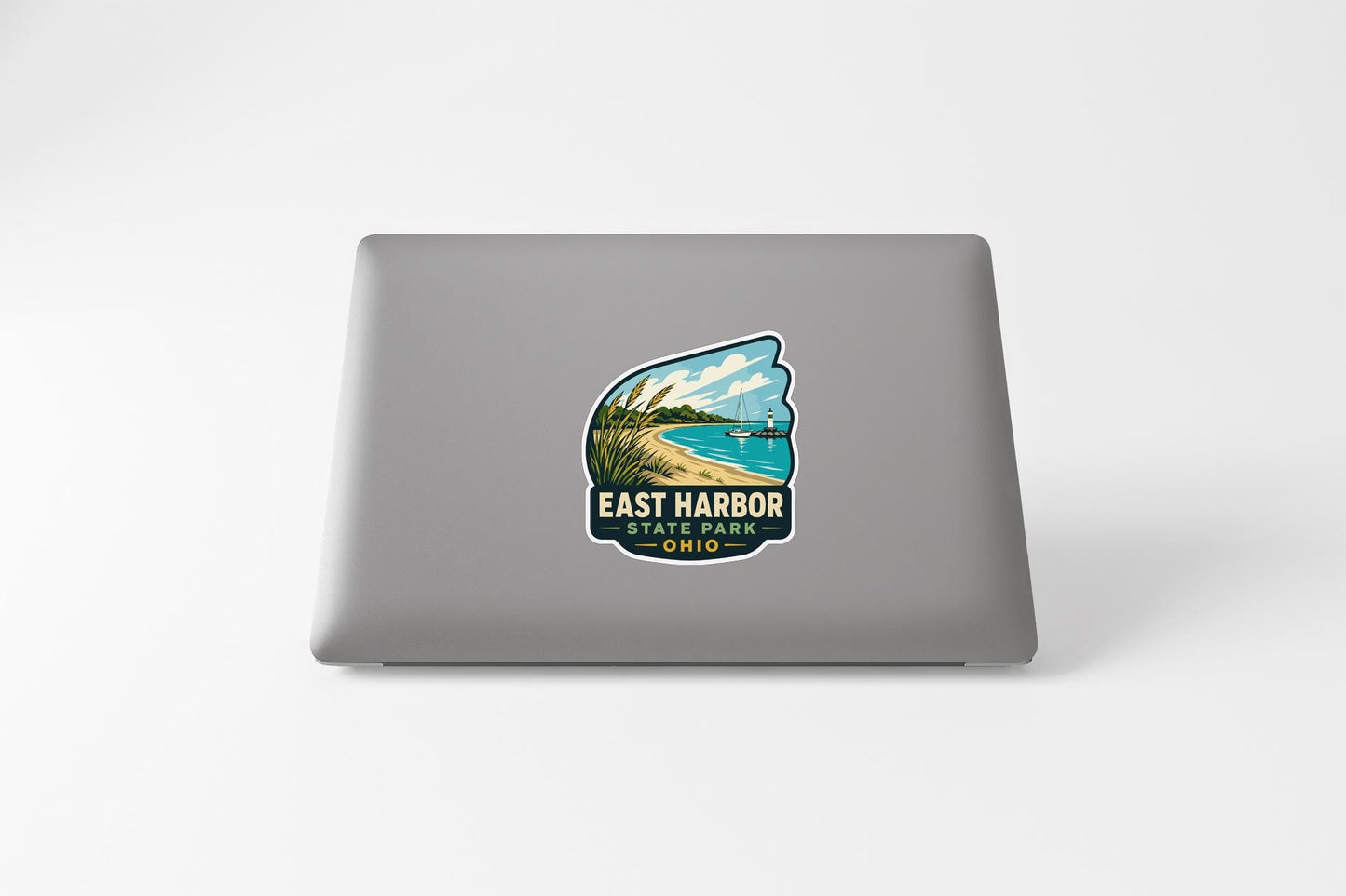 a sticker on the back of a laptop that says "EAST HARBOR, OHIO".