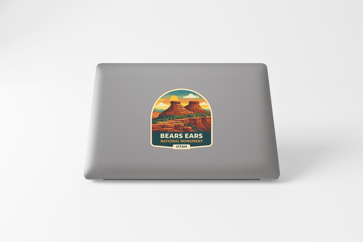 a sticker or label with a scenic illustration of a mountain range, specifically Bears Ears National Monument in Utah.