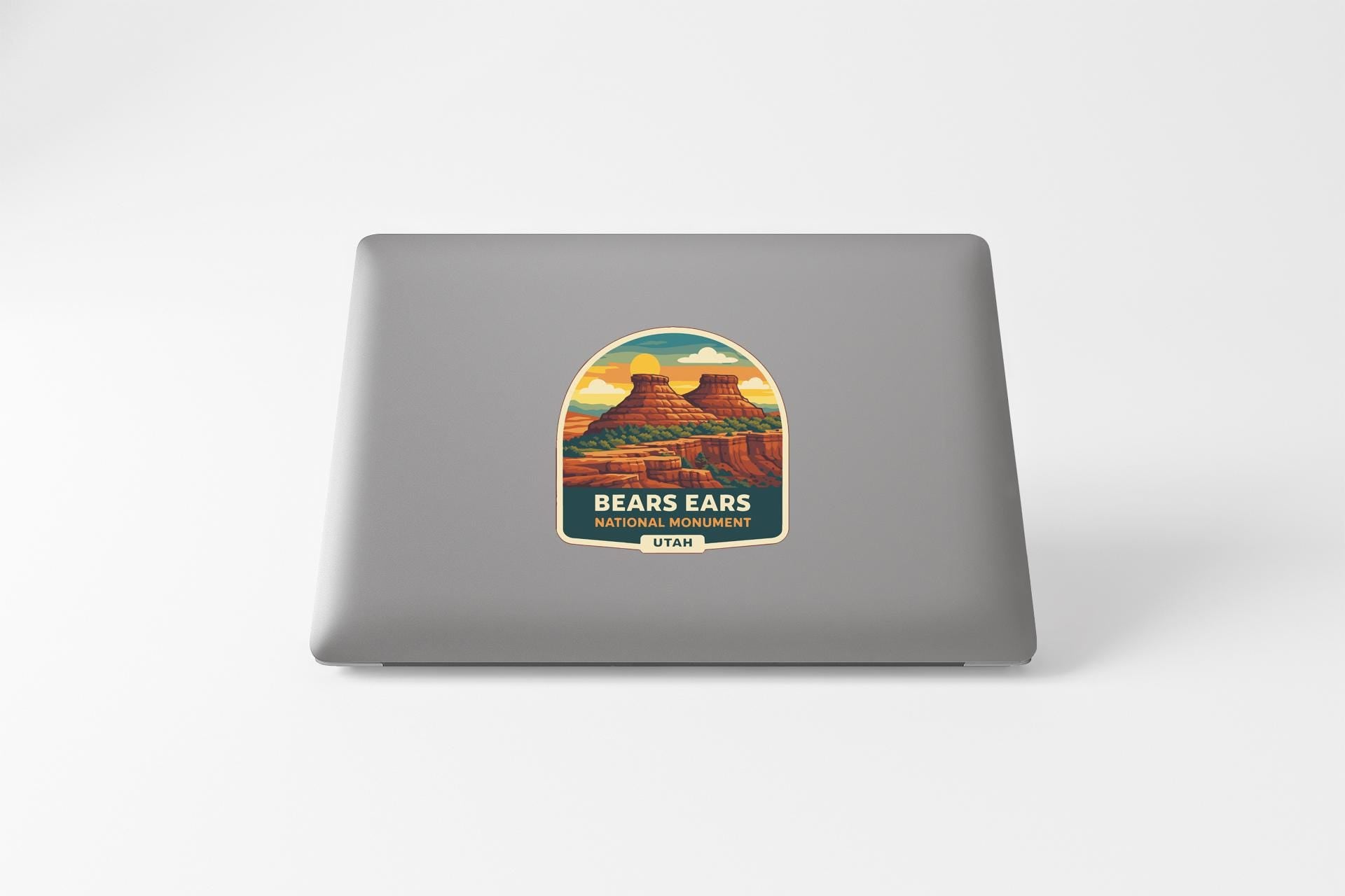a sticker or label with a scenic illustration of a mountain range, specifically Bears Ears National Monument in Utah.