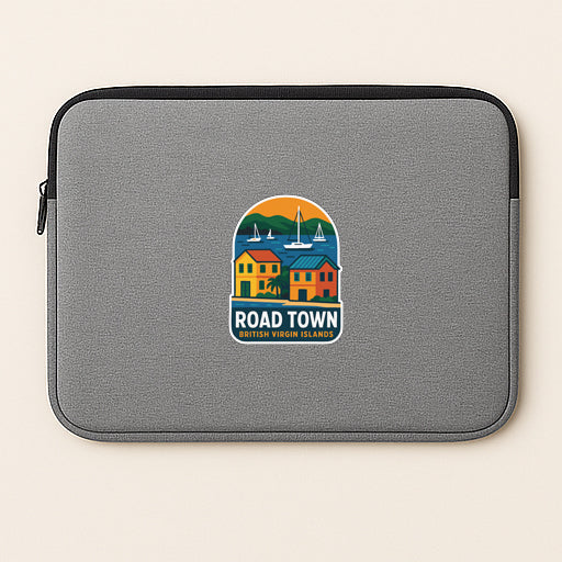 A gray laptop sleeve with a colorful logo depicting a road town and sailboats.