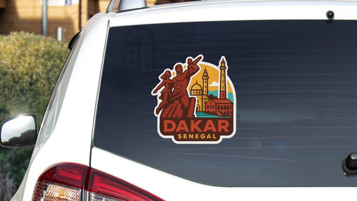 a sticker on the rear window of a car that says " Dakar Senegal".