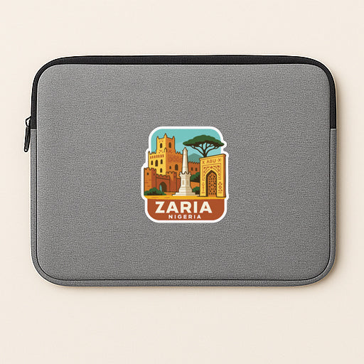 A gray laptop sleeve with a sticker depicting the city of Zaria, Nigeria.