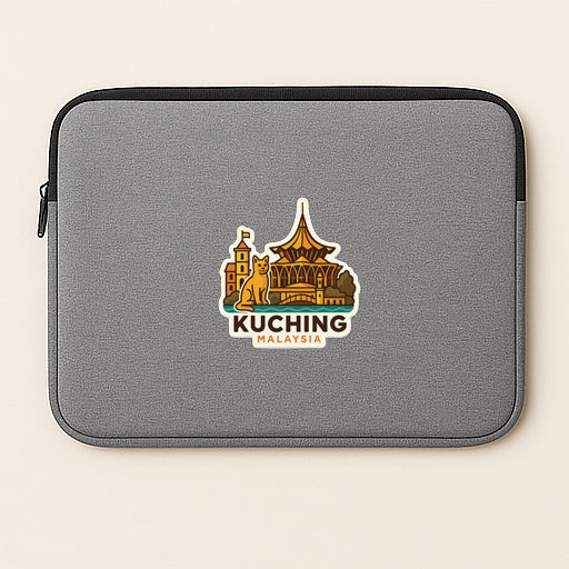 A gray laptop sleeve with a sticker depicting the skyline of Kuala Lumpur, Malaysia.