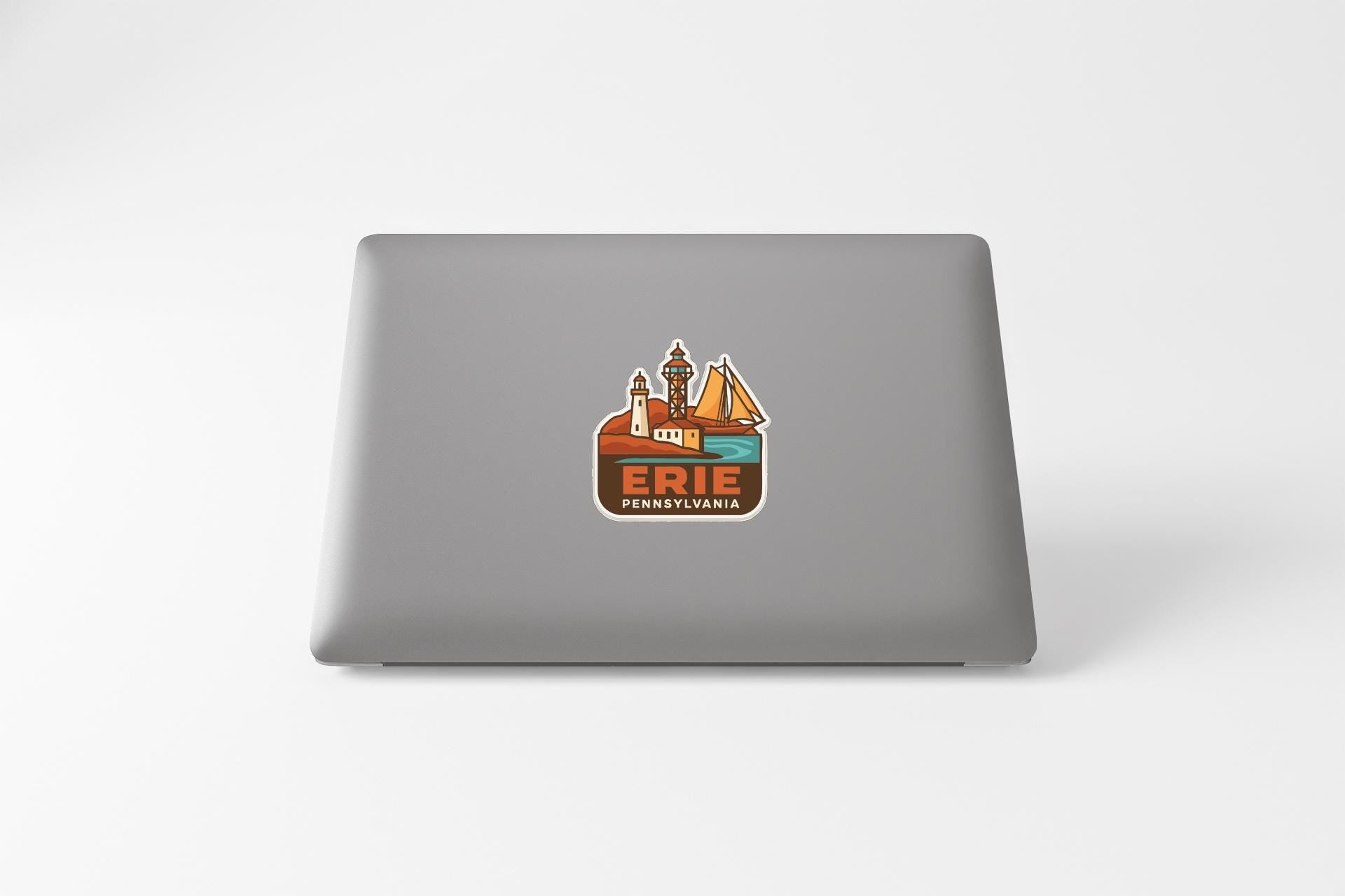 a sticker on the back of a laptop that says "ERIE PENNSYLVANIA".