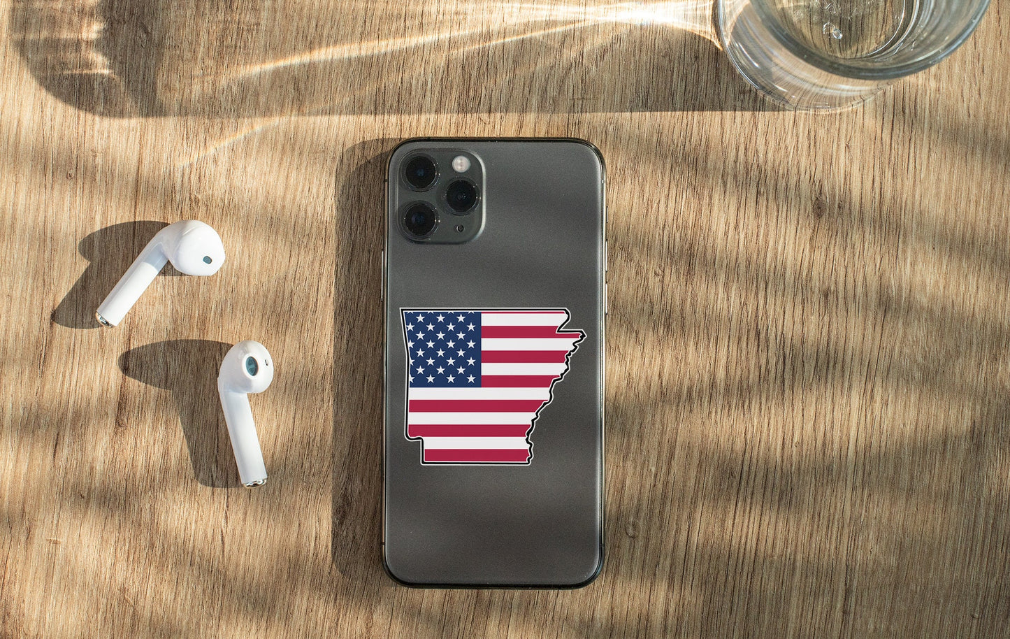 a cell phone with a sticker of the state of minnesota on it
