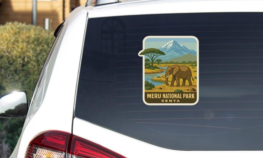 a sticker on the rear window of a car, depicting an elephant and the text "MERU NATIONAL PARK KENYA".