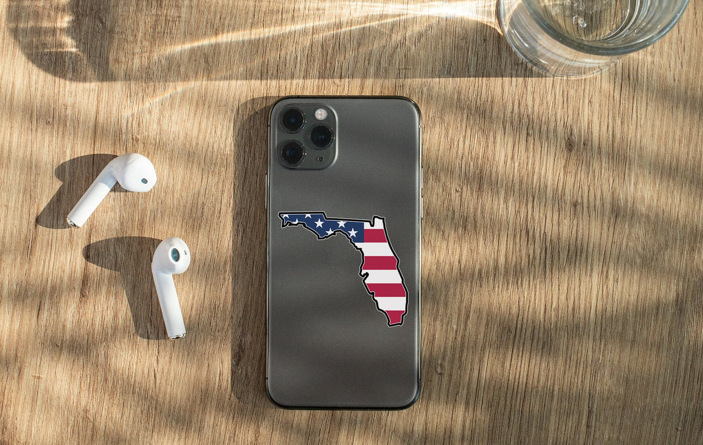 a cell phone with a sticker of the state of florida
