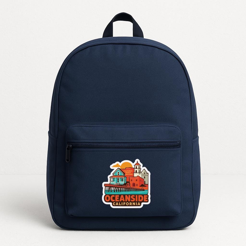 A navy blue backpack with a sticker on the front that says "OCEANSIDE CALIFORNIA".