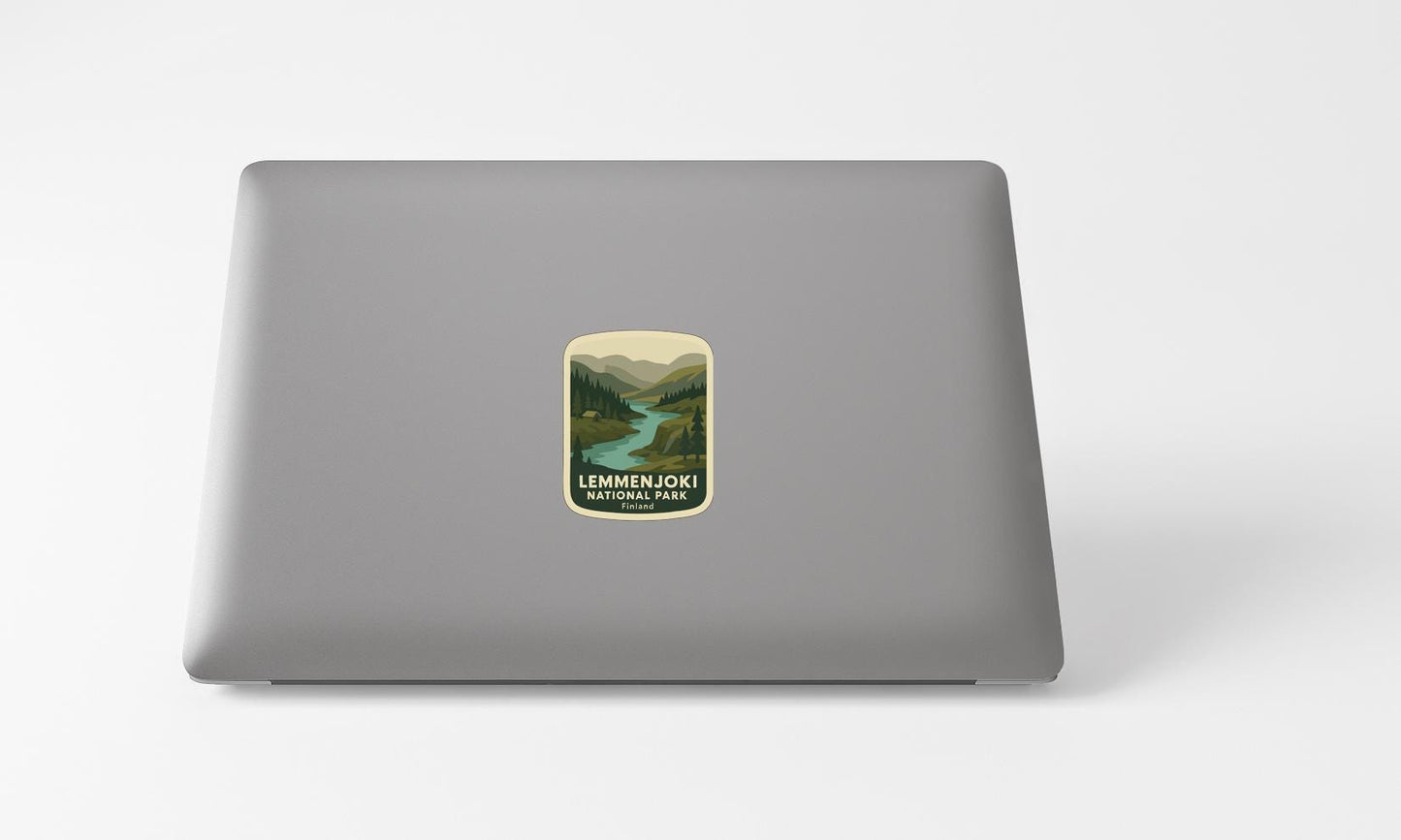 A sticker with a scenic landscape on a laptop.