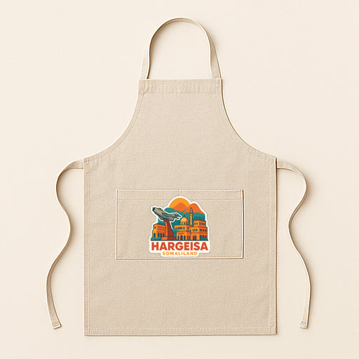 A beige apricot with a graphic design depicting a city skyline and the text "Hargeisa,UMALIAND" printed on it.
