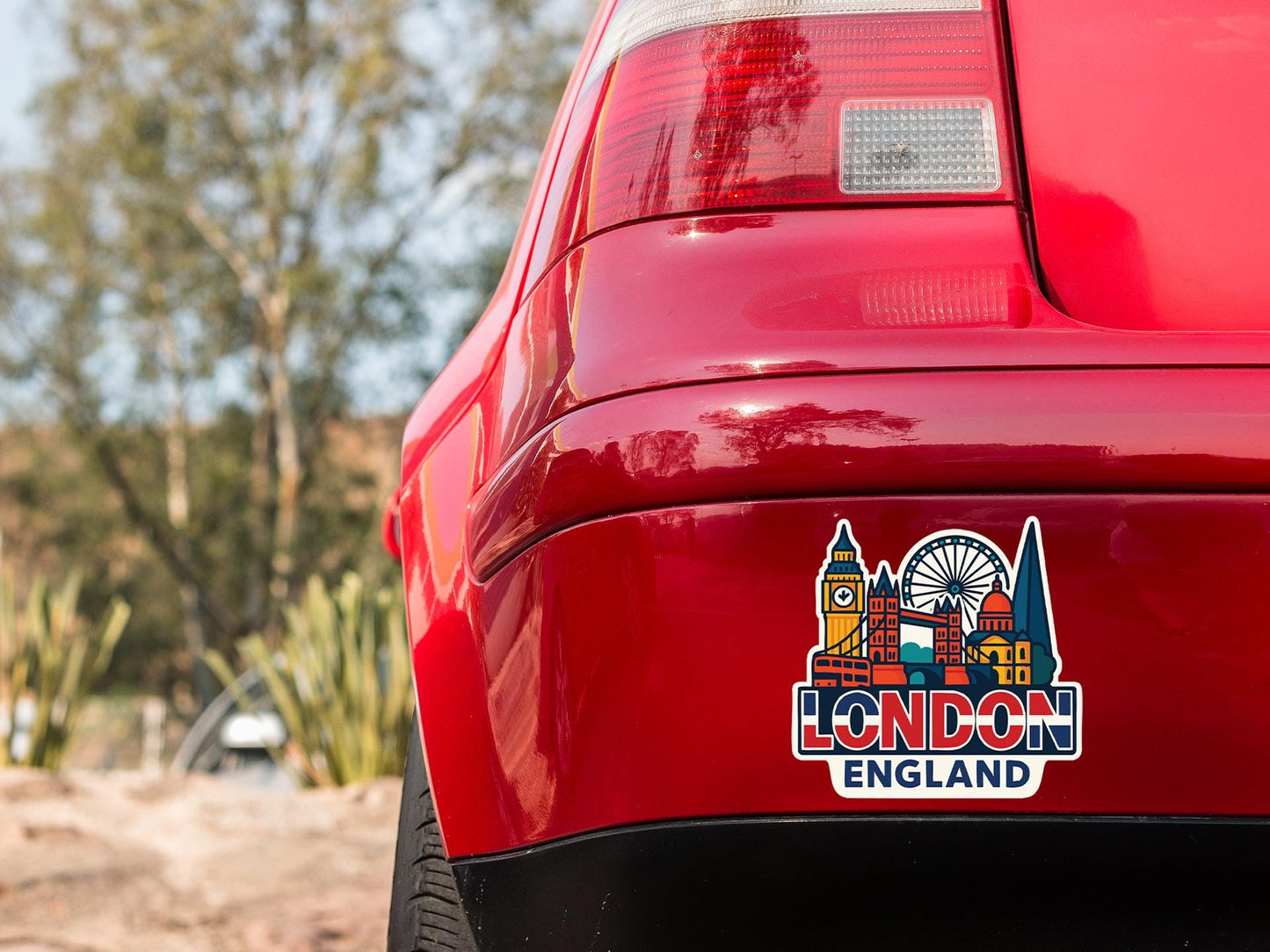 a red car with a london england sticker on it