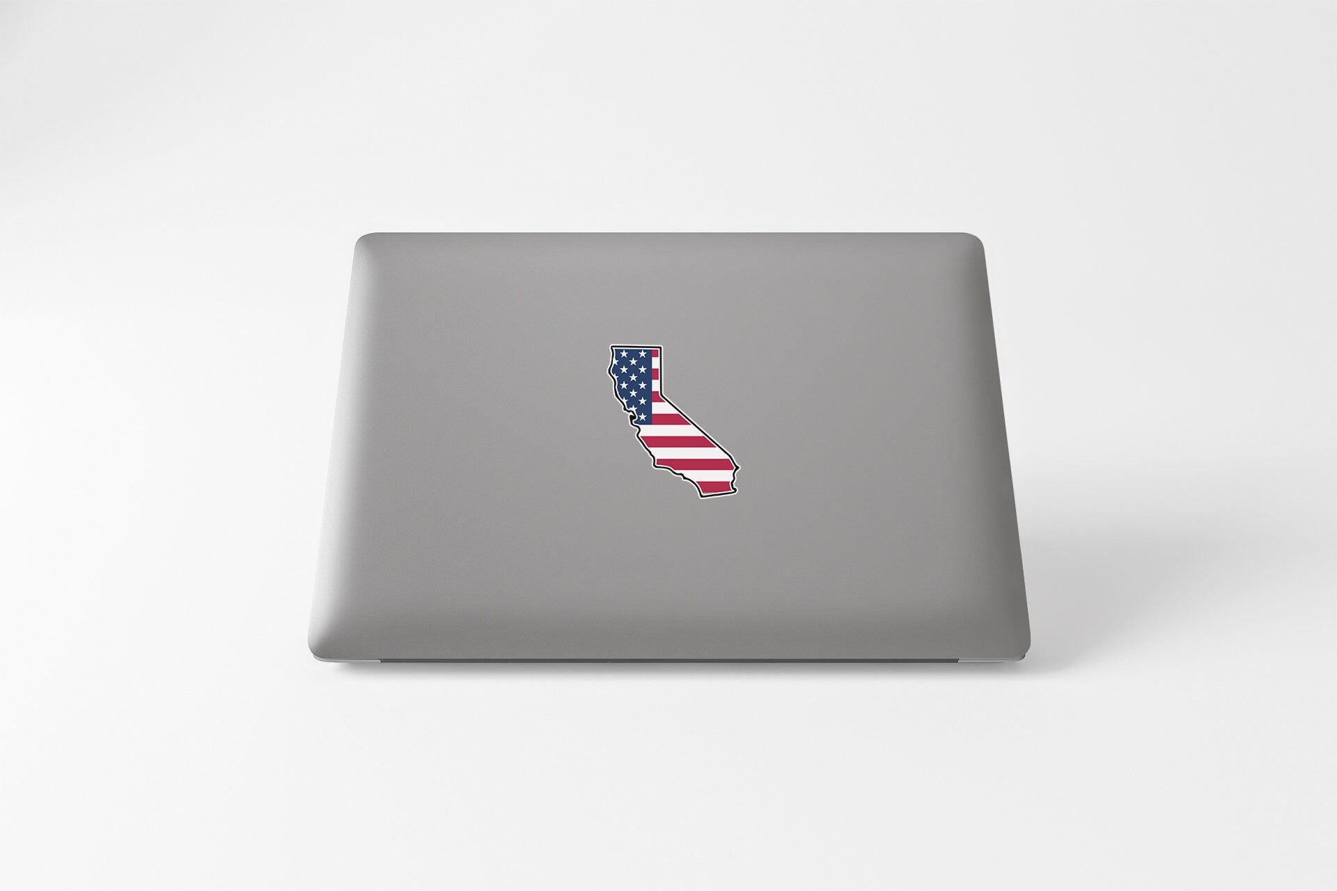 a laptop with a sticker of the state of california