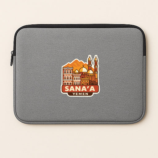 a gray laptop sleeve with a graphic design of a city skyline, including a mosque and other buildings, along with the text "Sana'a Yemen".