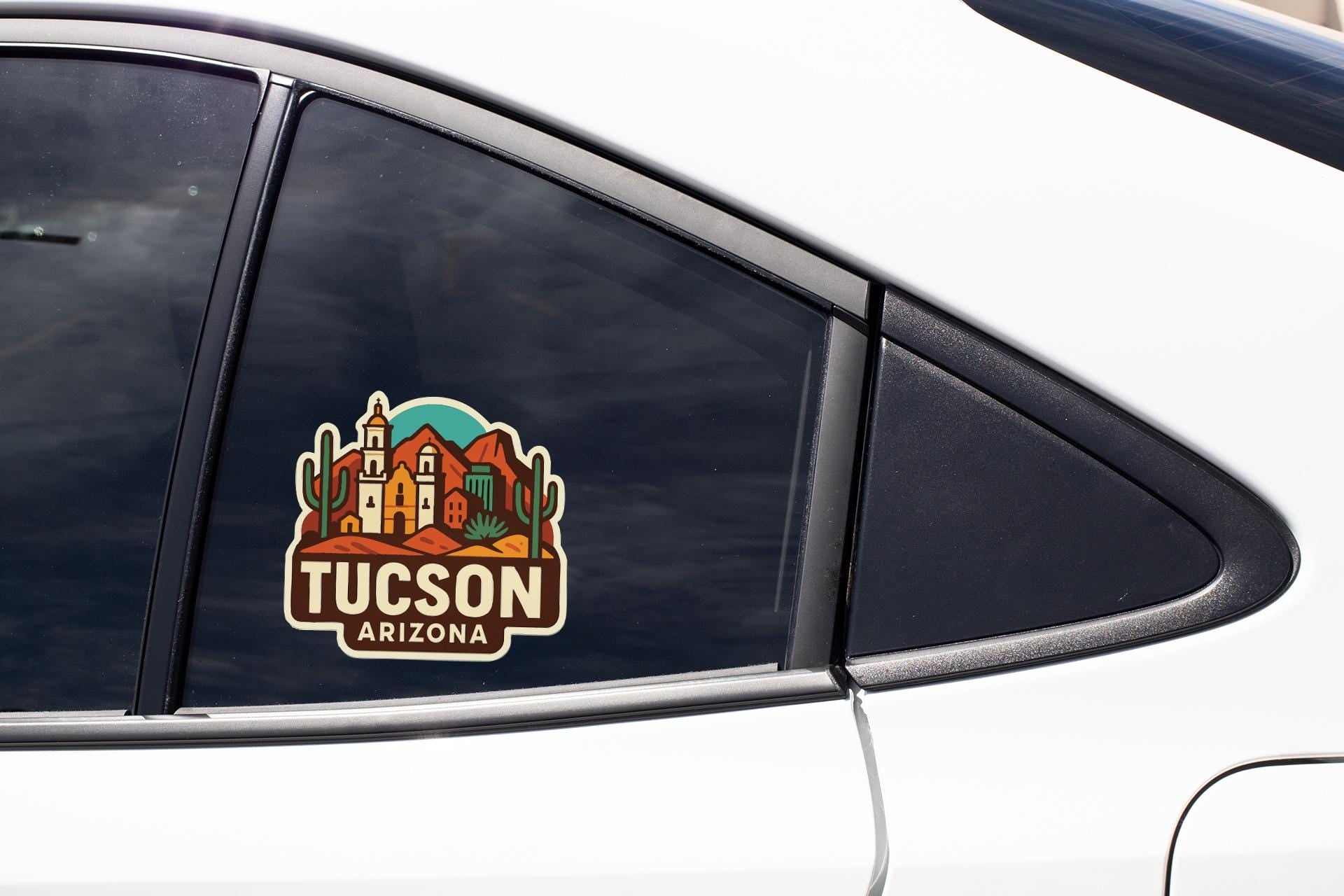 A car window with a sticker of the city of Tucson, Arizona.