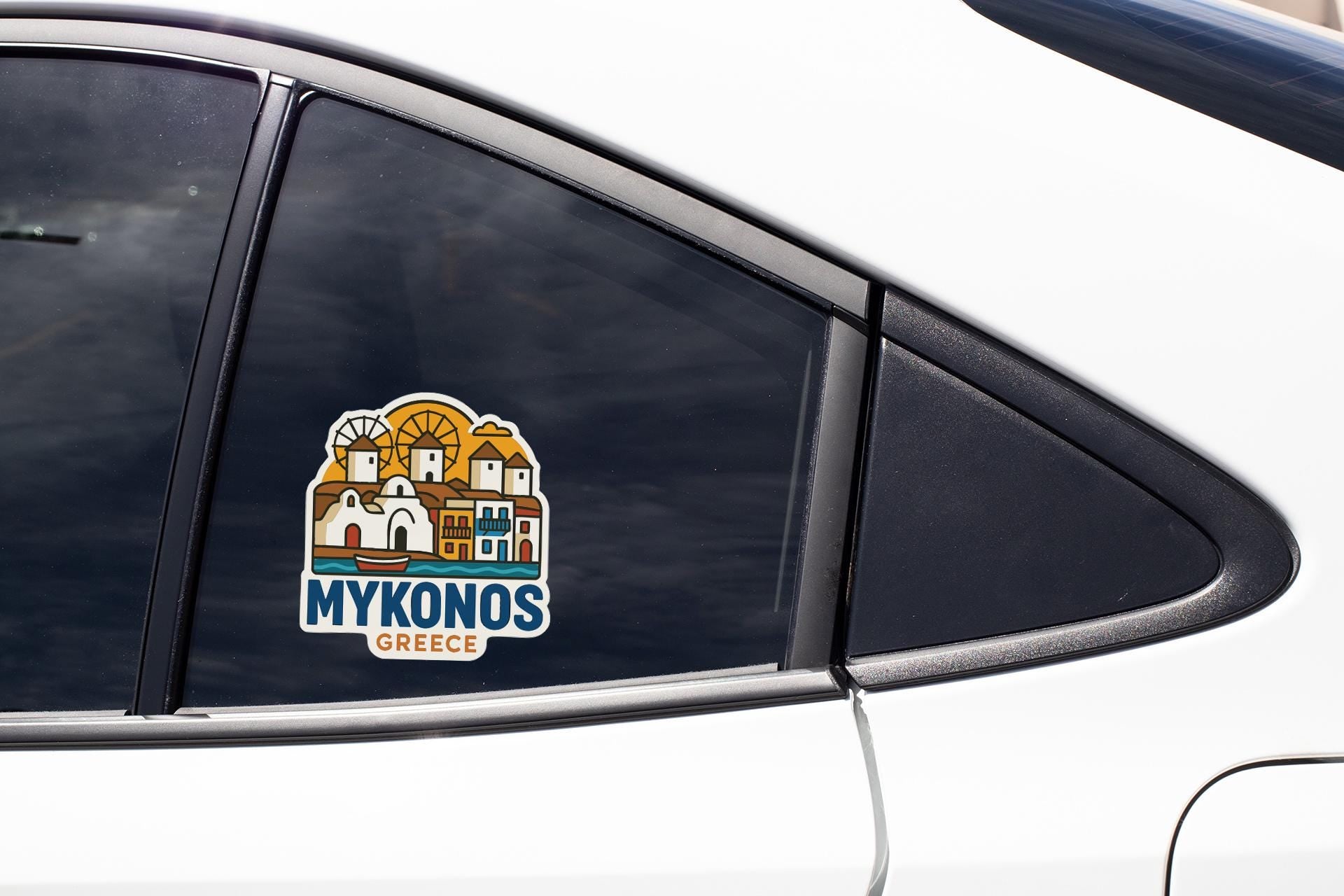 A sticker on the side of a car window, depicting a cityscape with the text "MYKONOS GREECE".