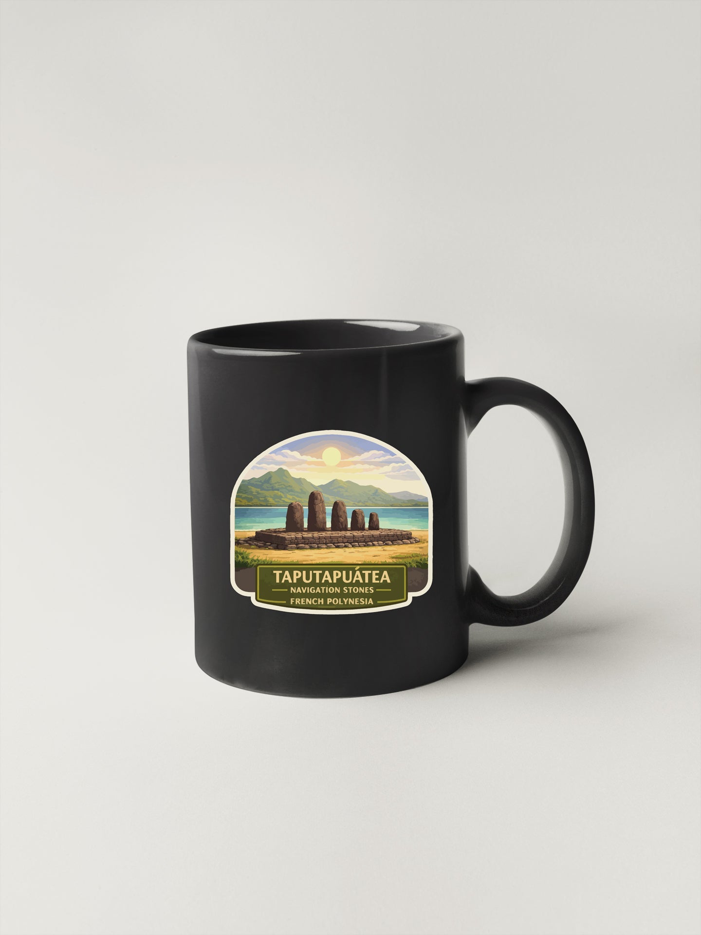 A black coffee mug with a label that says "TAPUTAPUATEA" and "FRENCH POLYNESIA" printed on it.