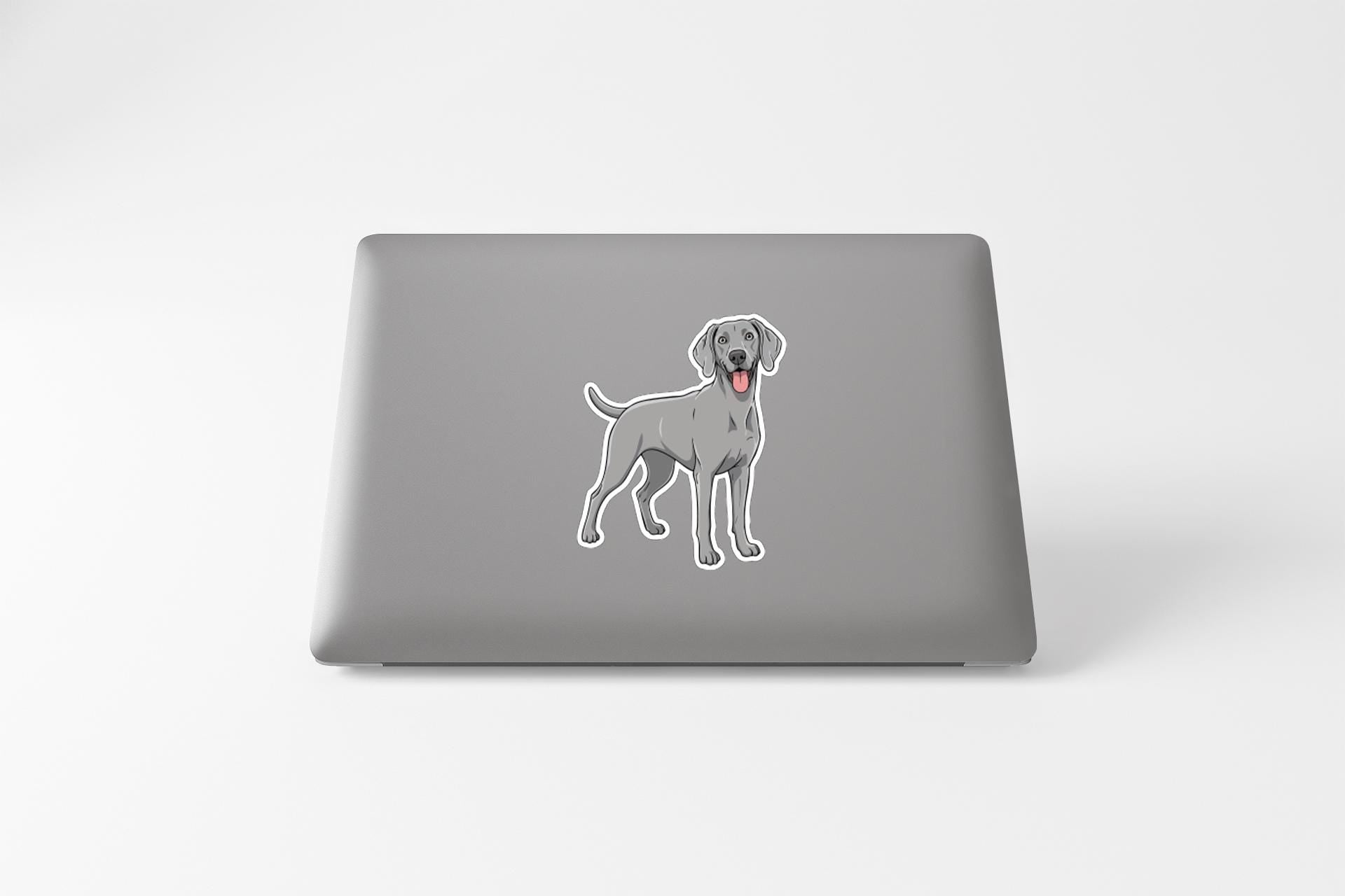 a sticker of a dog on the back of a laptop.