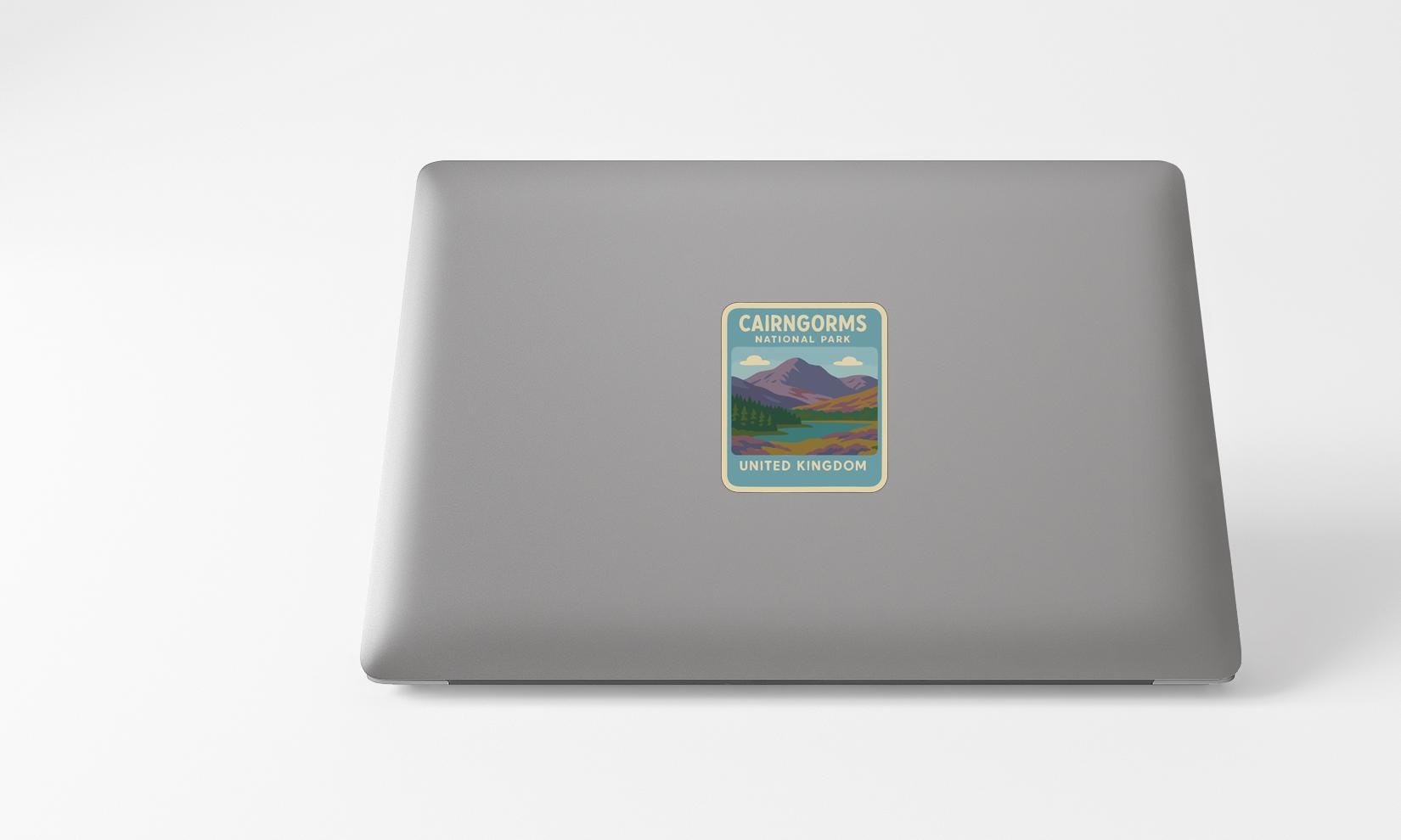 a sticker on the back of a laptop that says "Cairngorms National Park, United Kingdom".